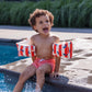 Bambino con braccioli Red White Whale in piscina